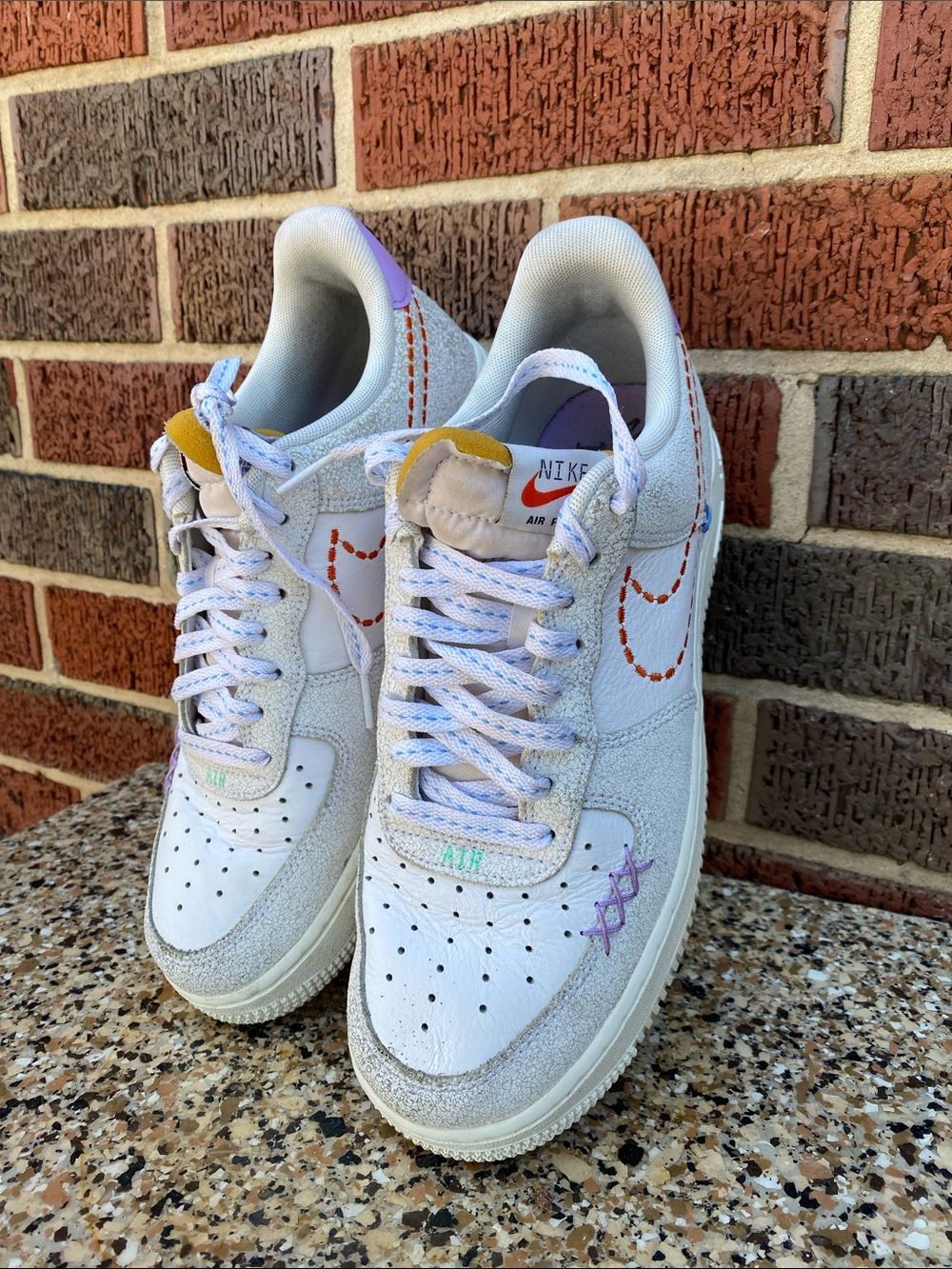 Nike Women's White Sneakers with Lavender and Yellow Accents